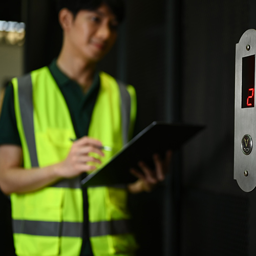 smiling-male-worker-wearing-reflective-jackets-che-2024-12-04-22-38-01-utc